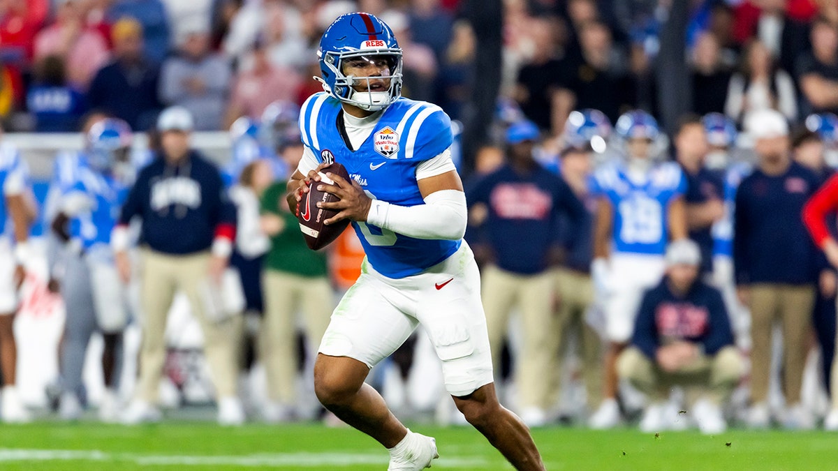 Ole Miss quarterback Trinidad Chambliss wearing jersey number 6 on the field.