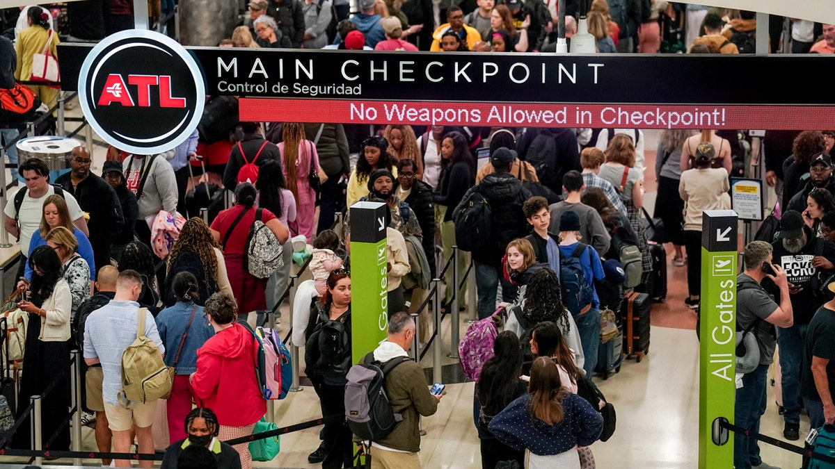 Flight passengers use TSA PreCheck Touchless ID to skip long airport lines 1 Hartsfield-Jackson Atlanta International Airport travelers in tsa lines