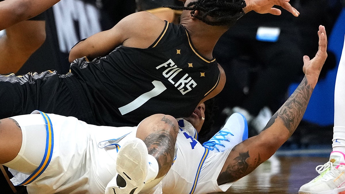 Skyy Clark has a tooth chipped by UCF’s Themus Fulks