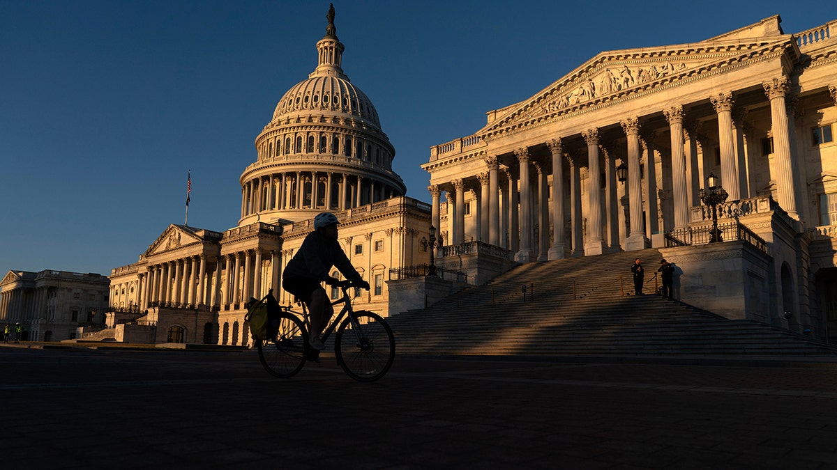 The U.S. Capitol building during sunrise.