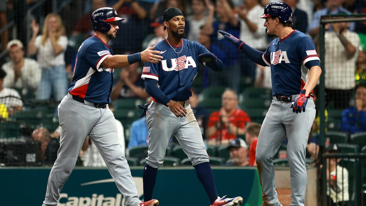 Cal Raleigh #29, Byron Buxton #25, and Roman Anthony #3 of the United States celebrate after scoring from an RBI double hit by Brice Turang #13 of the United States in the fifth inning against Brazil during the 2026 World Baseball Classic Pool B game between the United States and Brazil at Daikin Park on March 6, 2026, in Houston, Texas. 