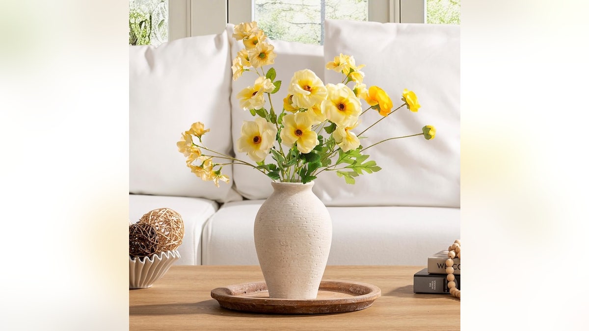 Display spring flowers in a tall vase.