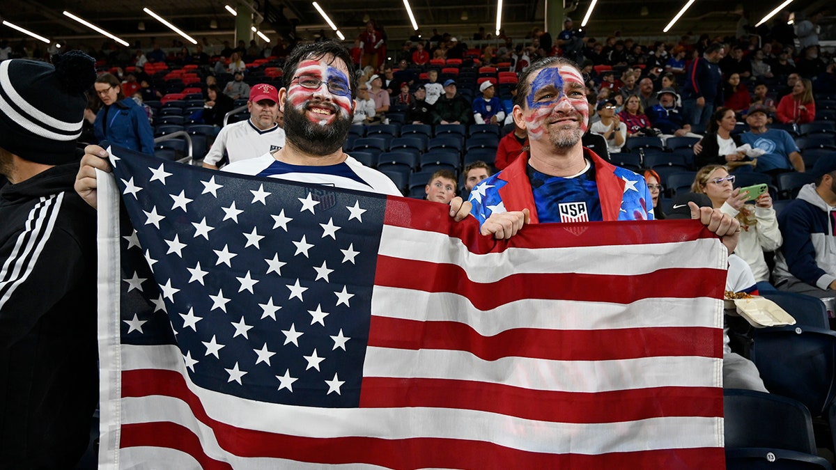 USA fans holding the American flag