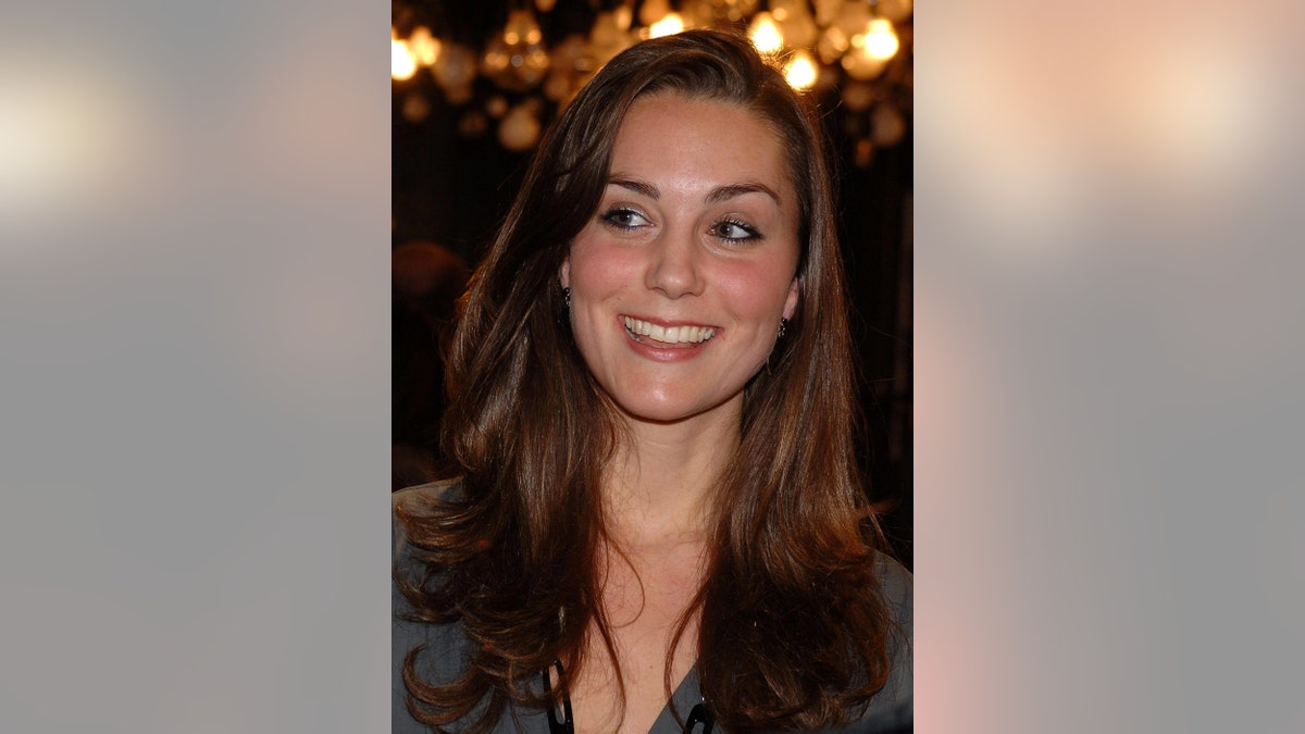 A close-up of a smiling young Kate Middleton.