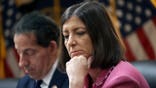 Then-Rep. Elaine Luria sitting on a dais in Congress