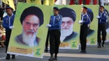 Posters of Ayatollah Khomeini and Khamenei
