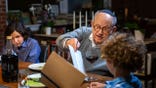 A grandfather and grandchild at the Passover table.