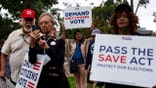 People with signs supporting the SAVE act at Upper Senate Park