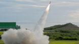 A Patriot surface-to-air missile streaks into the sky during a live-fire military exercise at a coastal base in Taiwan.