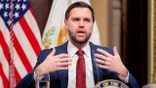 Vice President JD Vance speaking at a podium during a meeting
