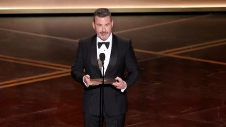 Late-night host Jimmy Kimmel shows up to 'No Kings' protest with kids, holds 'enough already' sign