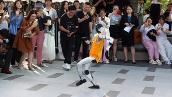 Robot's lifeless corpse hauled off stage after fall during disastrous Michael Jackson impression