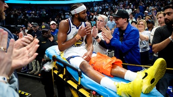 Warriors' Moses Moody leaves game on stretcher after suffering gruesome injury on dunk attempt