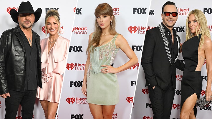 Jenny McCarthy and Donnie Wahlberg walk the red carpet at the 2026 iHeartRadio Music Awards