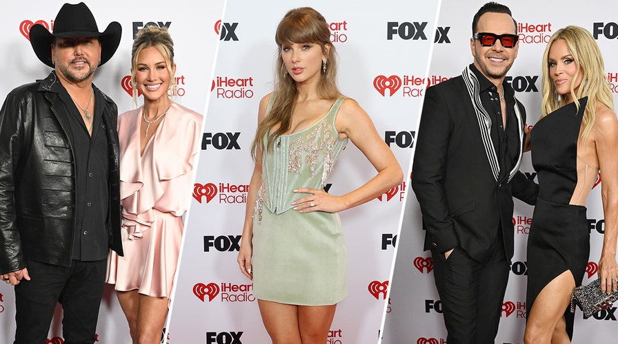 Jenny McCarthy and Donnie Wahlberg walk the red carpet at the 2026 iHeartRadio Music Awards