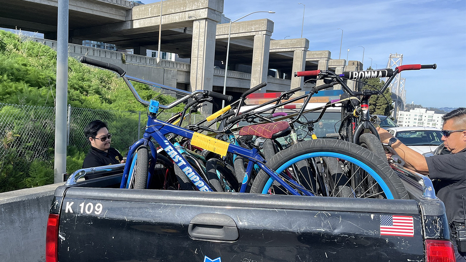 Police officers basal   adjacent   confiscated bicycles aft  Bay Bridge takeover attempt