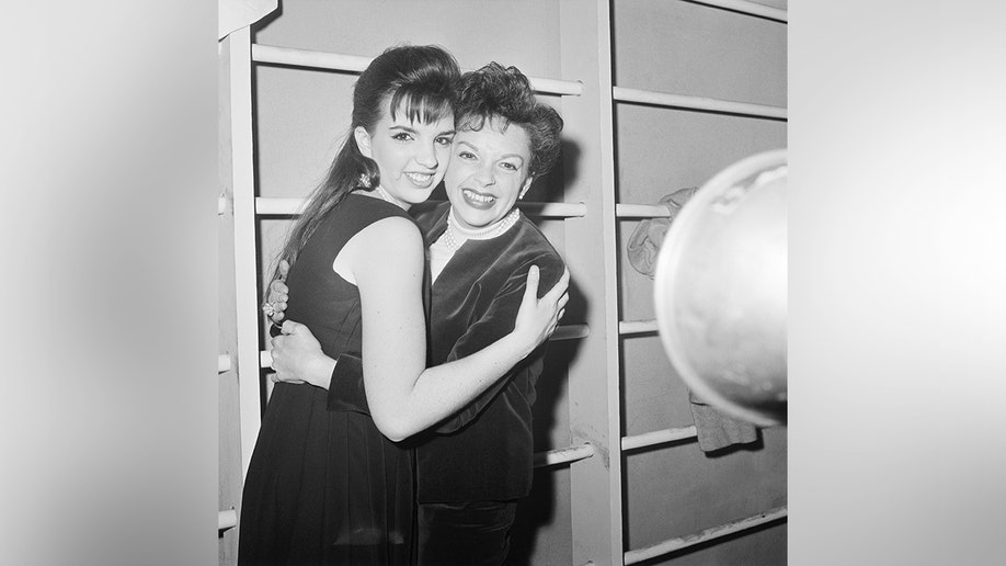 Judy Garland hugging Liza Minnelli during an embrace.