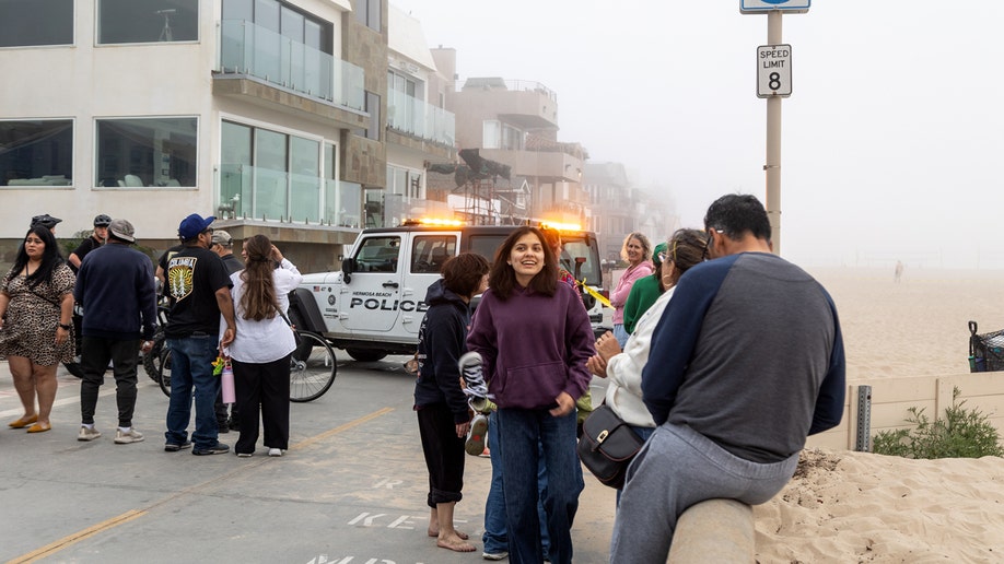 People stitchery  adjacent   constabulary  country   during Hermosa Beach standoff investigation