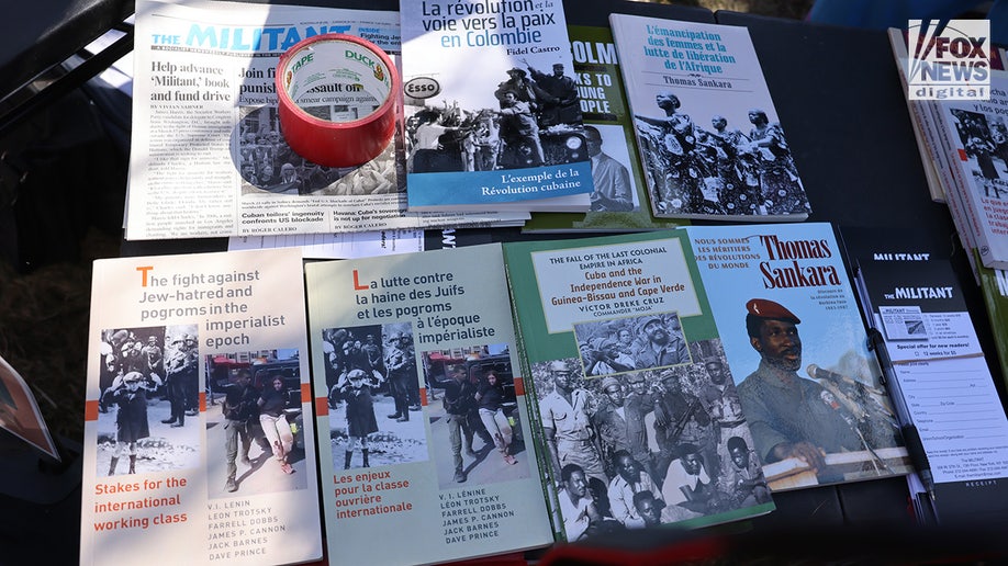 Protesters gathering with communist and socialist reading materials in front of the Minnesota State Capitol building