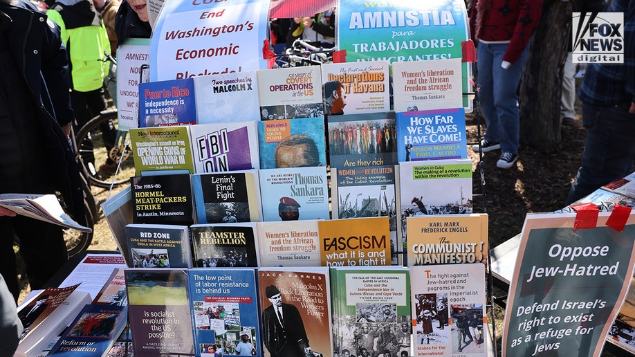 Protesters gathering with communist and socialist reading materials in front of the Minnesota State Capitol building.
