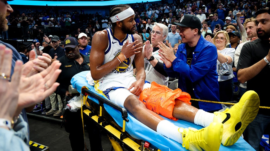 Warriors' Moses Moody leaves game on stretcher after suffering gruesome injury on dunk attempt