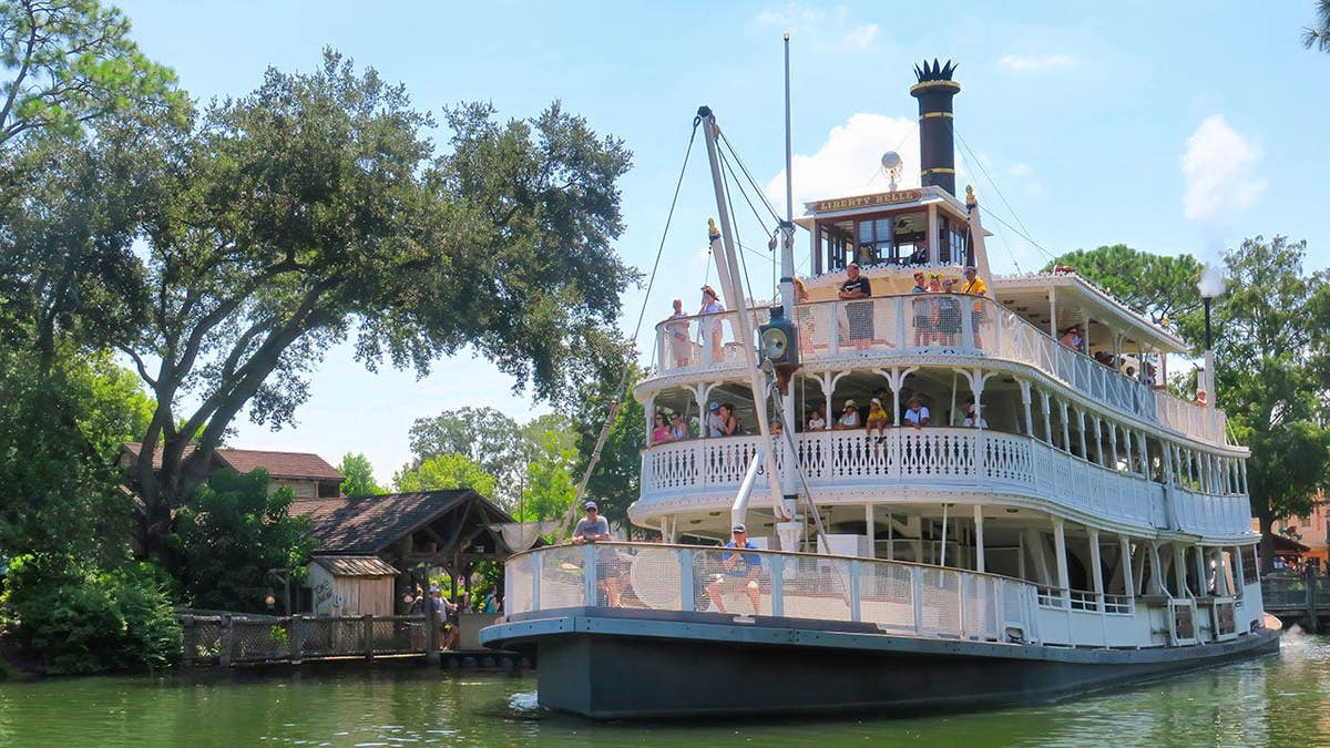 The riverboat Liberty Belle sailing past Tom Sawyer Island at Magic Kingdom Walt Disney World