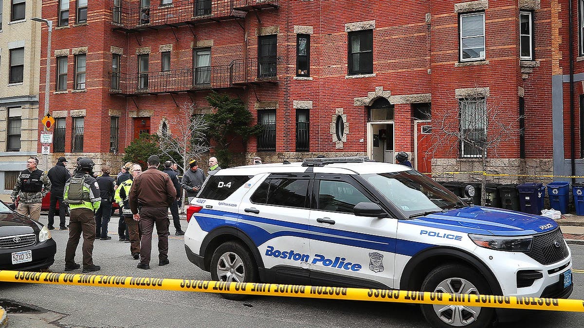 Boston Police and investigators are at a brownstone