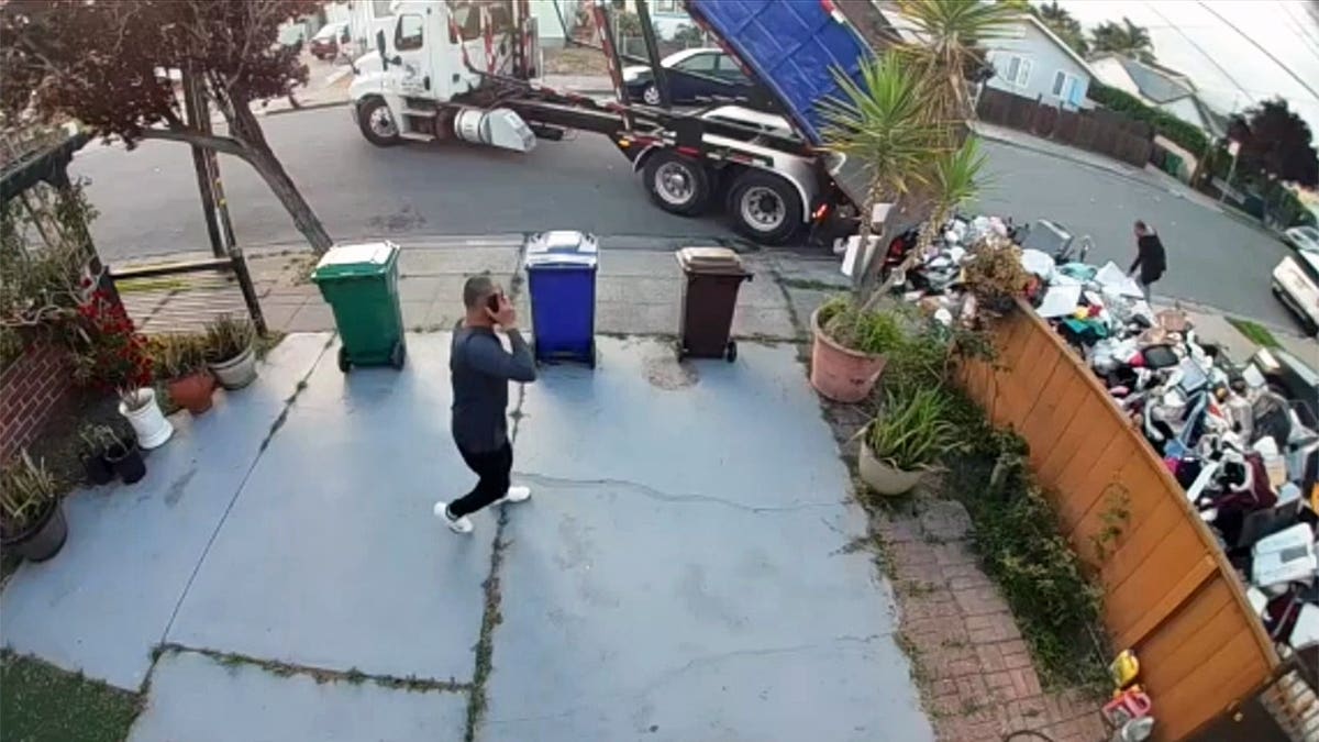 Truck dumps trash onto person's lawn in California