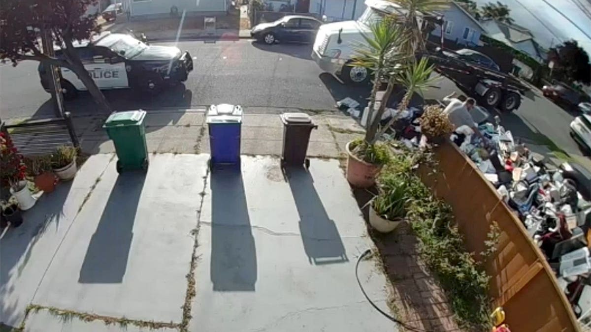 Police arrive after trash dumped on front lawn in California