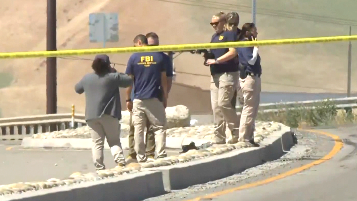 FBI agents respond to the ICE-involved shooting scene on April 7, 2026.