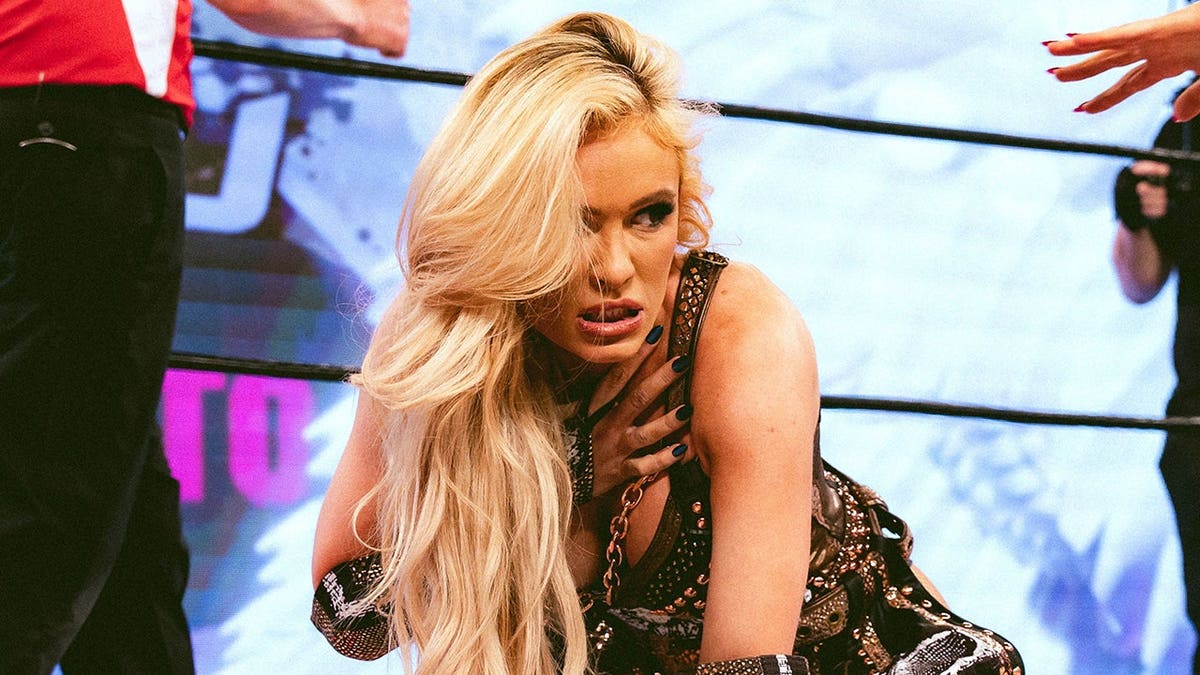 Scarlett Bordeaux looks on