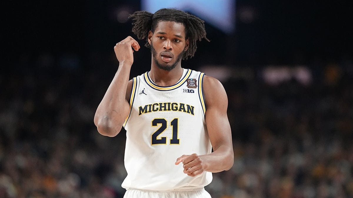 Morez Johnson Jr. walks connected  the hoops  court