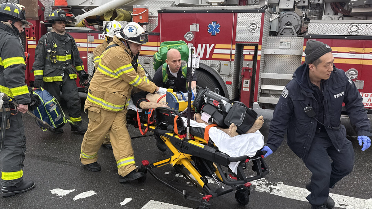 Victim being wheeled on stretcher