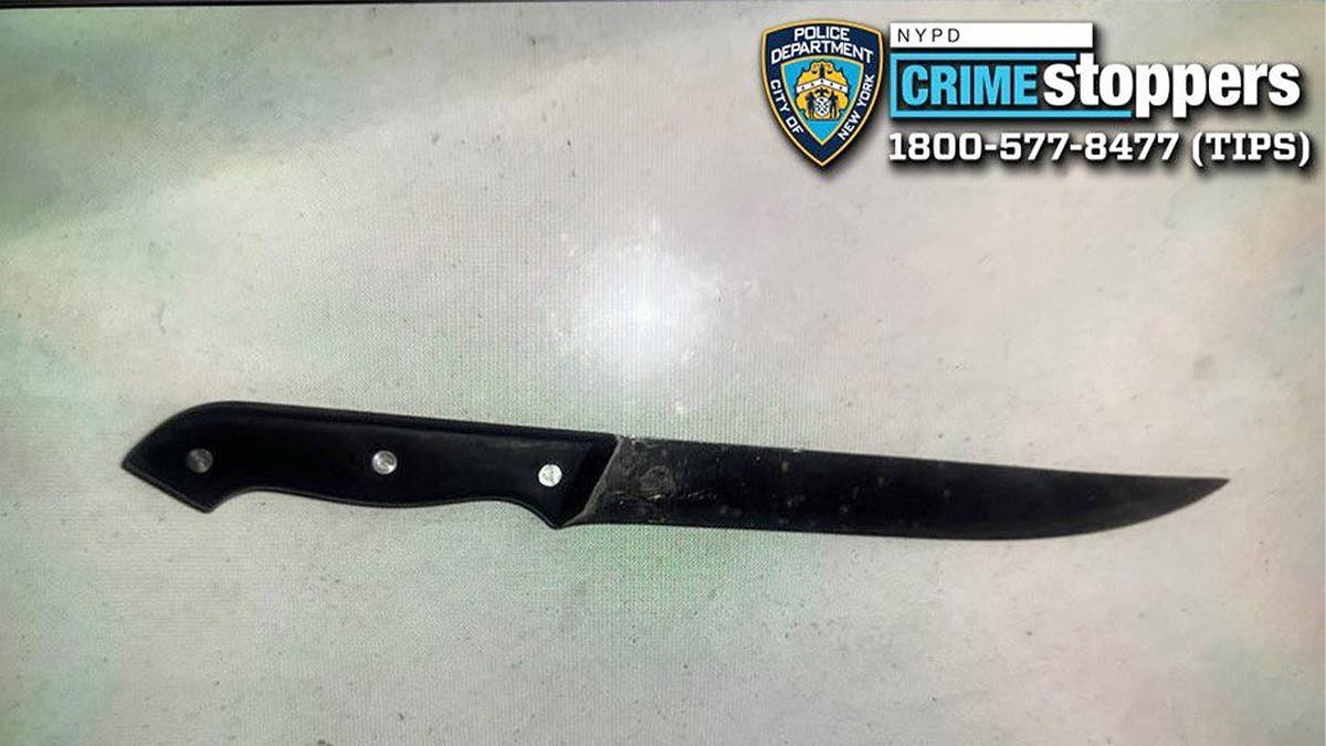 13-inch kitchen knife with black handle.