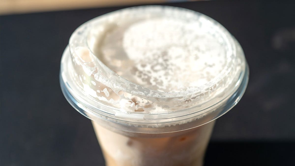 Starbucks iced chai is a drink with a transparent lid
