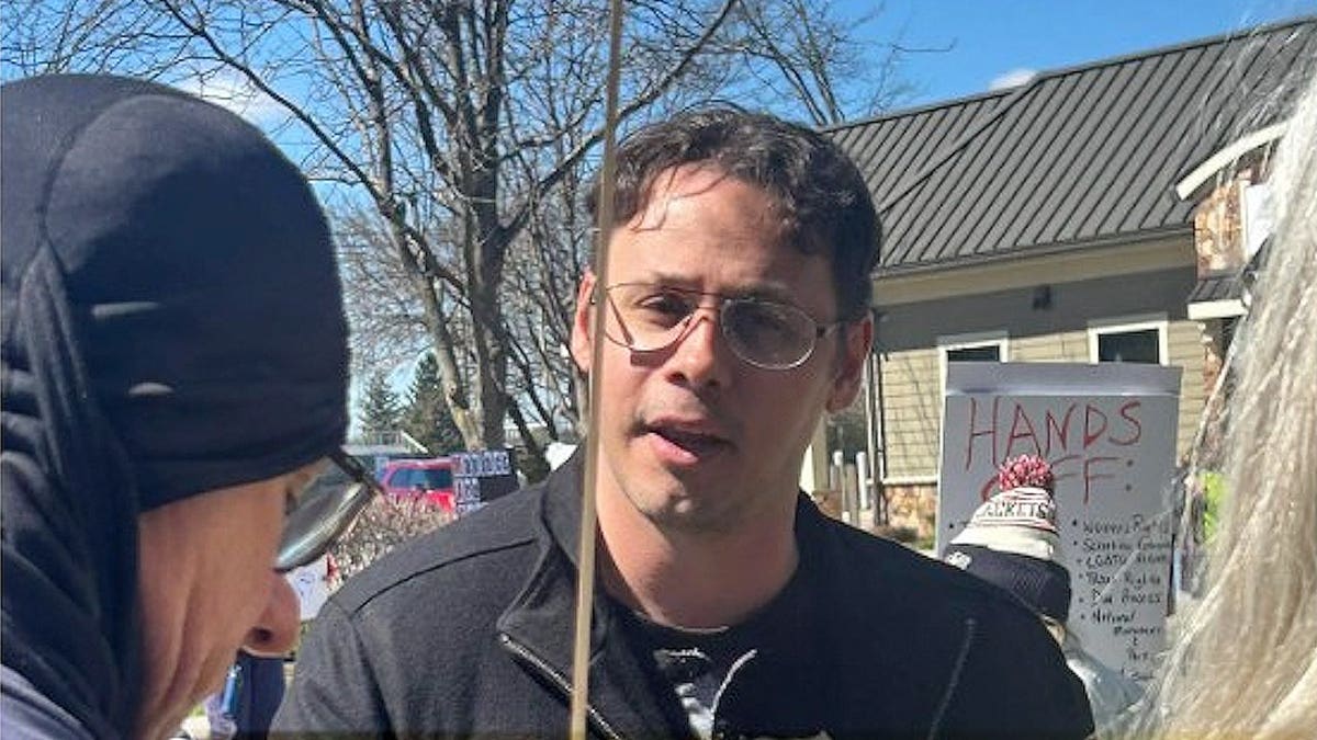 Sam Ronan seen speaking with a crowd