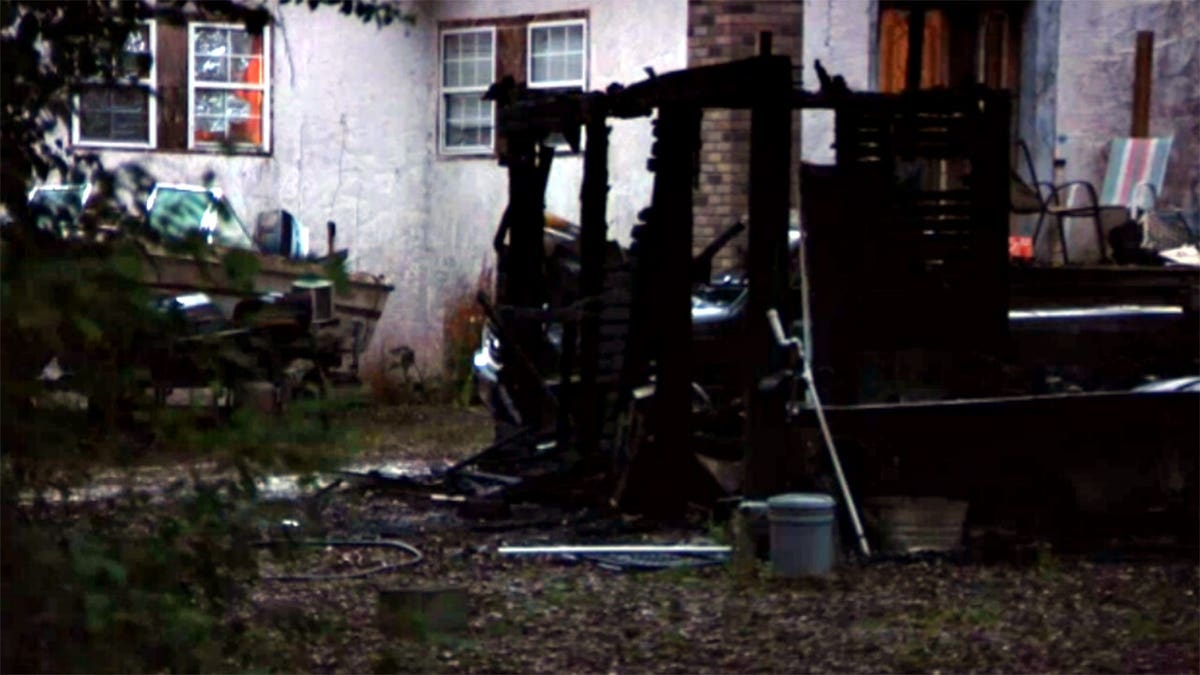 the remains of a burned Florida shed