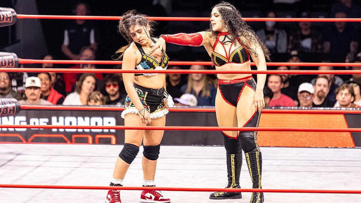 Persephone pushes Johnnie Robbie