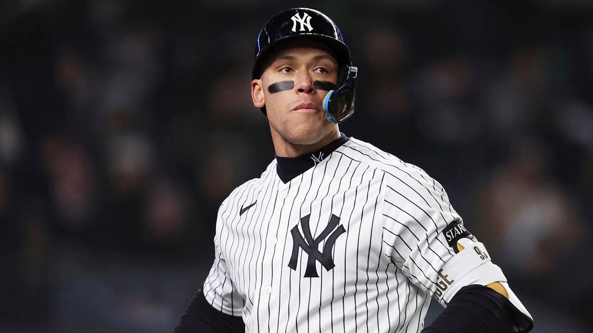 New York Yankees' Aaron Judge striking out during a baseball game.