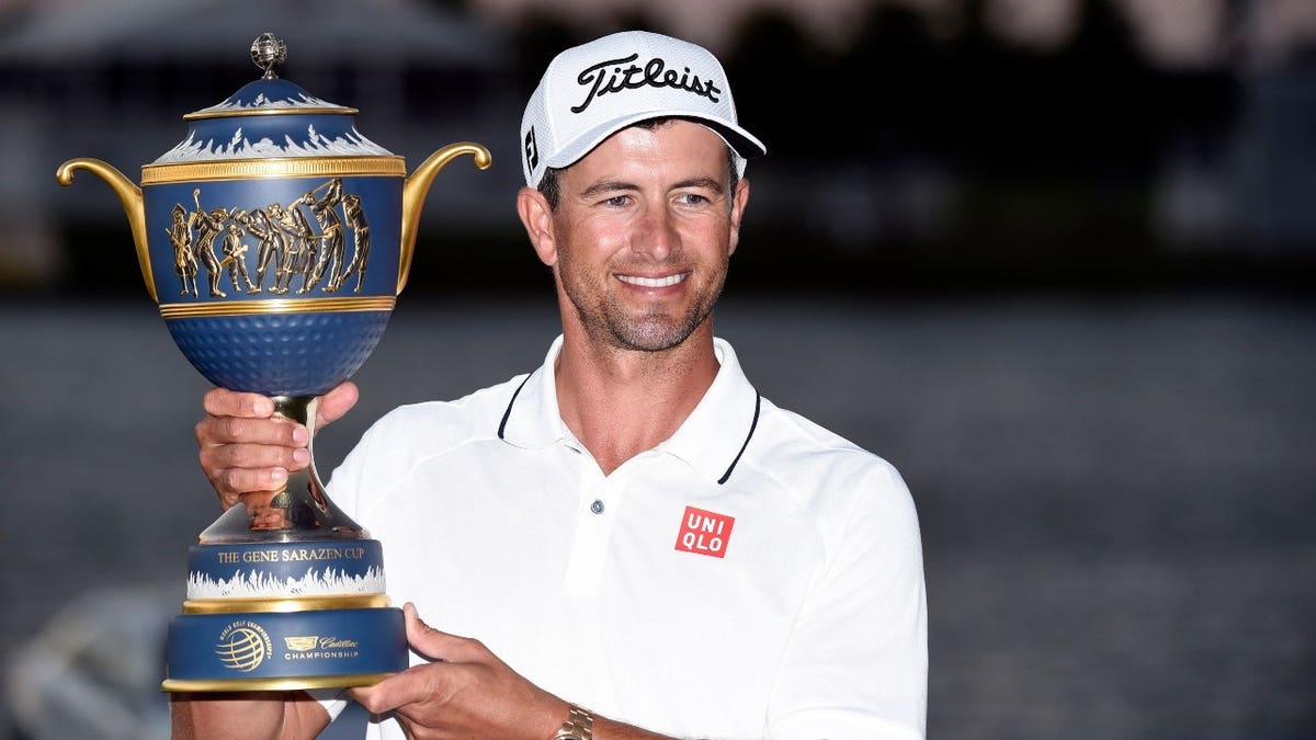 Adam Scott celebrates with the Gene Sarazen Cup after winning the 2016 WGC-Cadillac Championship at the Trump National Doral's Blue Monster course in Miami.