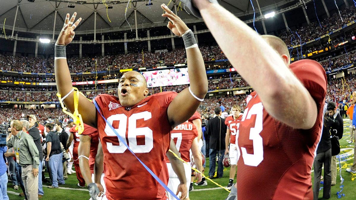 Alabama Crimson Tide defensive lineman Luther Davis celebrating on the field.