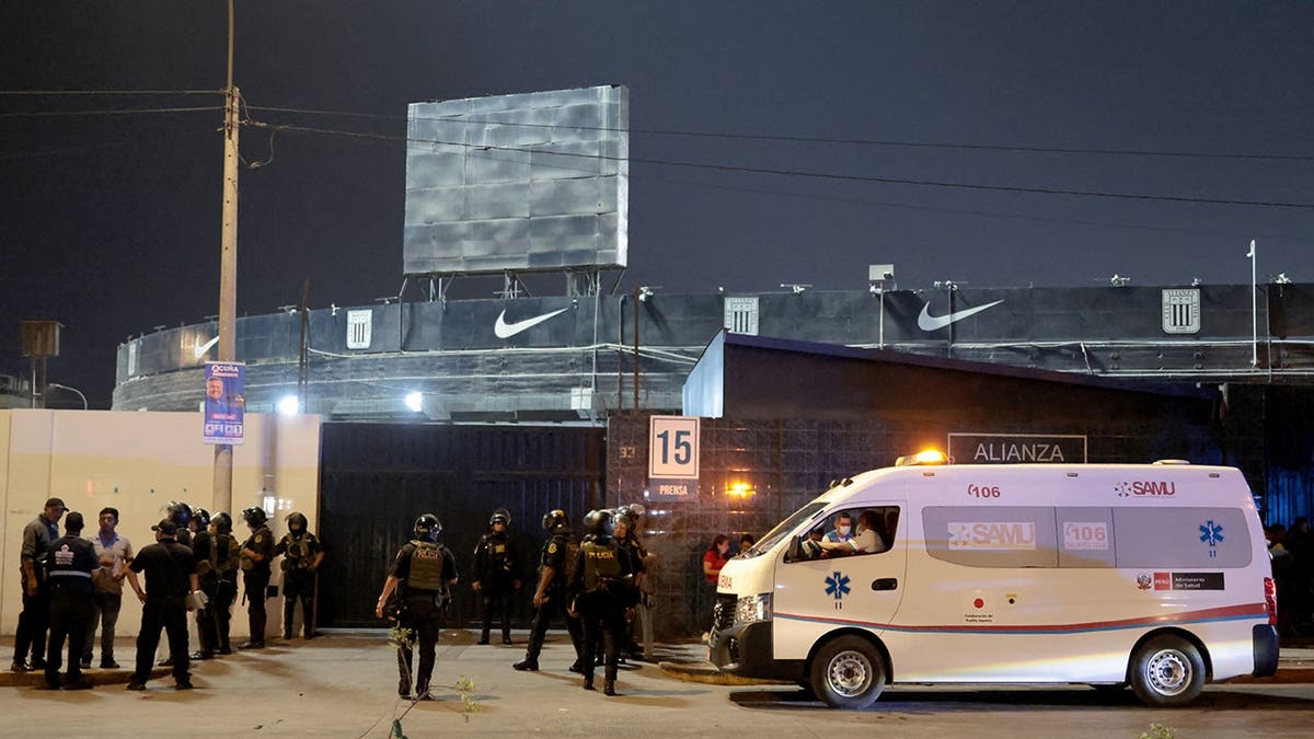 An ambulance parked at the entrance of Alejandro Villanueva Stadium in Lima