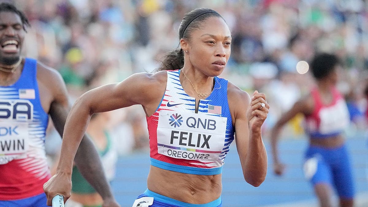 Allyson Felix celebrating after 4x400 meter mixed relay race at World Championships