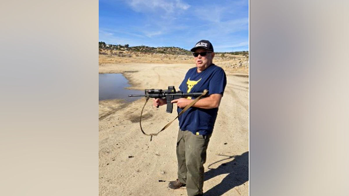 Man holding rifle in desert area in DOJ firearms case image