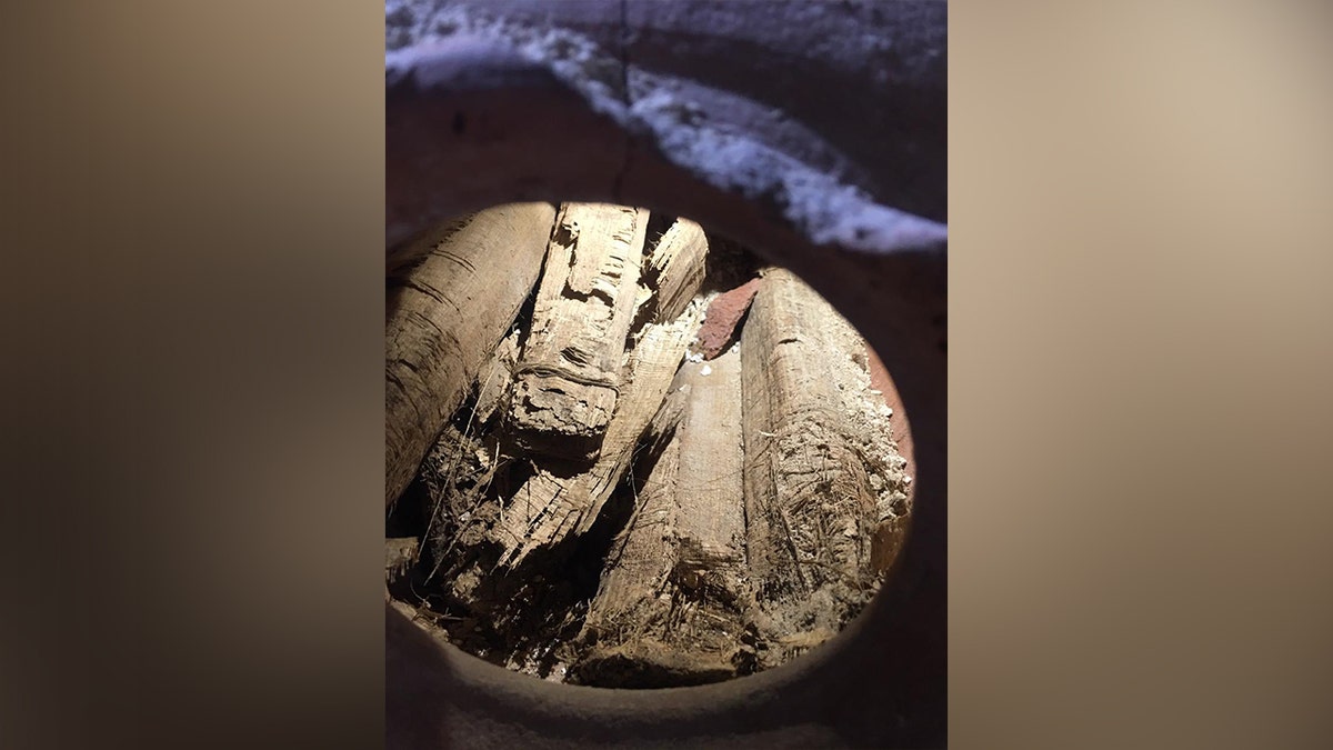 Bucket of ancient scrolls in chamber