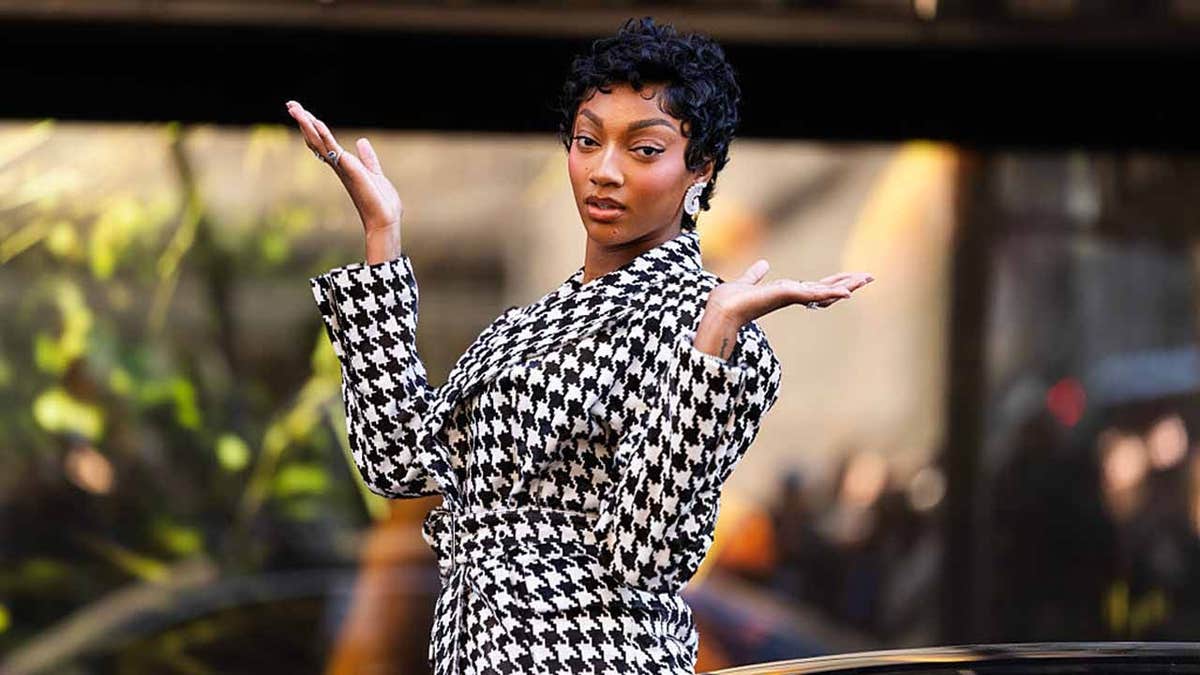 Angel Reese standing outside Victoria's Secret flagship store in Midtown New York City