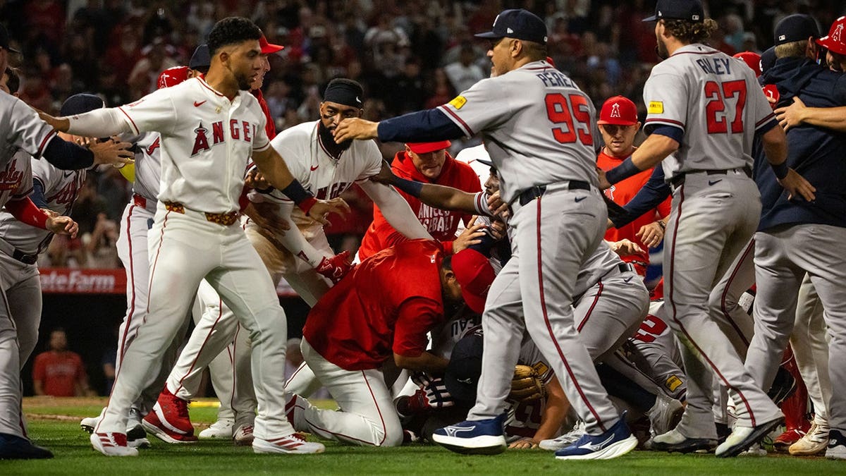 A fight breaking out between Los Angeles Angels and Atlanta Braves players on a baseball field