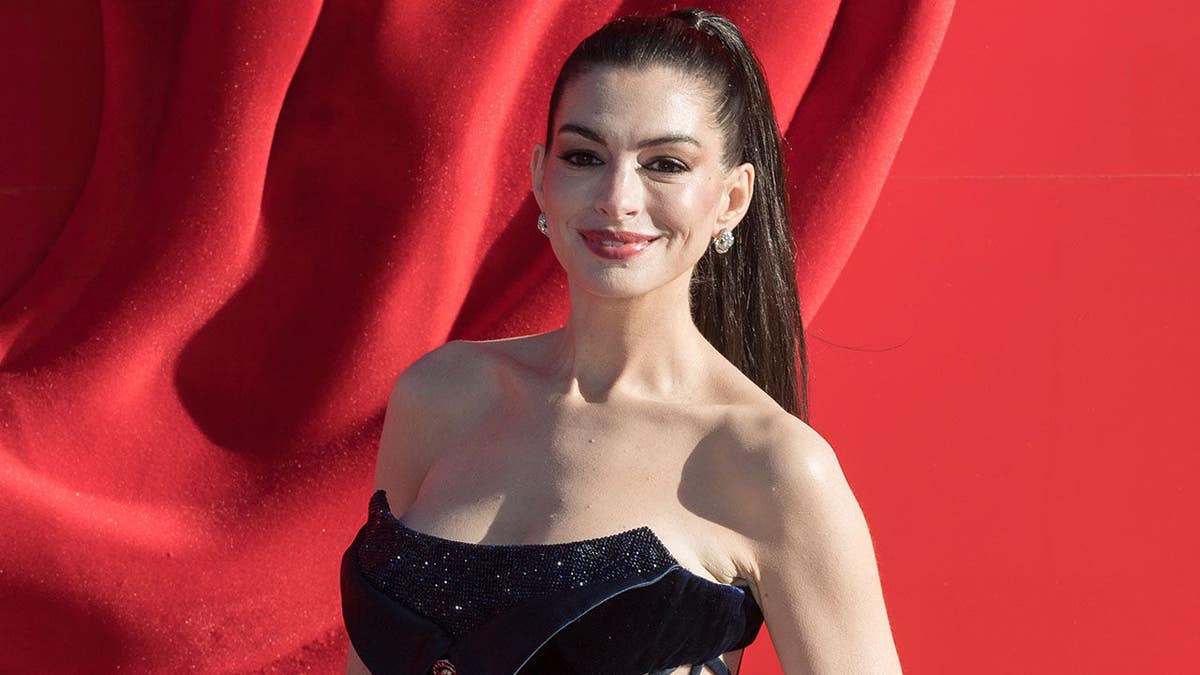 Anne Hathaway standing on red carpet at European premiere of The Devil Wears Prada 2 in London