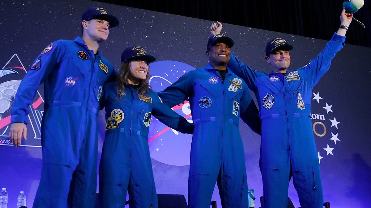 Astronauts Jeremy Hansen, Christina Koch, Victor Glover and Reid Wiseman on stage at Ellington Field in Houston