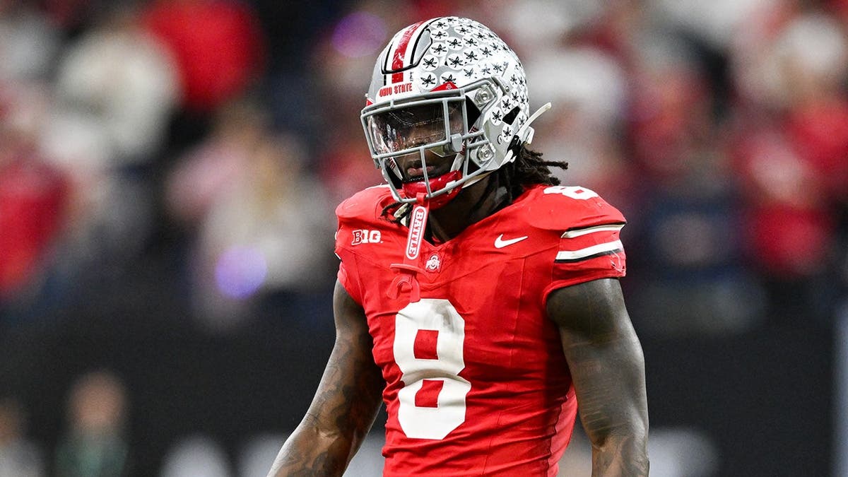 Ohio State Buckeyes linebacker Arvell Reese runs on the football field at Lucas Oil Stadium